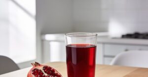 How much pomegranate juice daily provides the best health benefits?